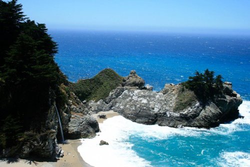 Julia Pfeiffer Falls and the Pacific Ocean in Big Sur, California.